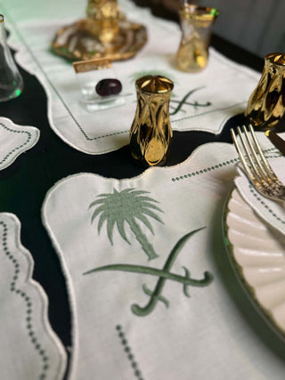 Royal Palm & Swords Green Inspired Design Green Placemat Set - Premium Fabric - 6 Persons - 19 Pieces arranged elegantly on a dining table.