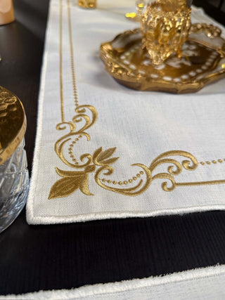 Classic Floral Gold Design Placemat Set - Premium Fabric - 6 Persons - 19 Pieces on a dining table.